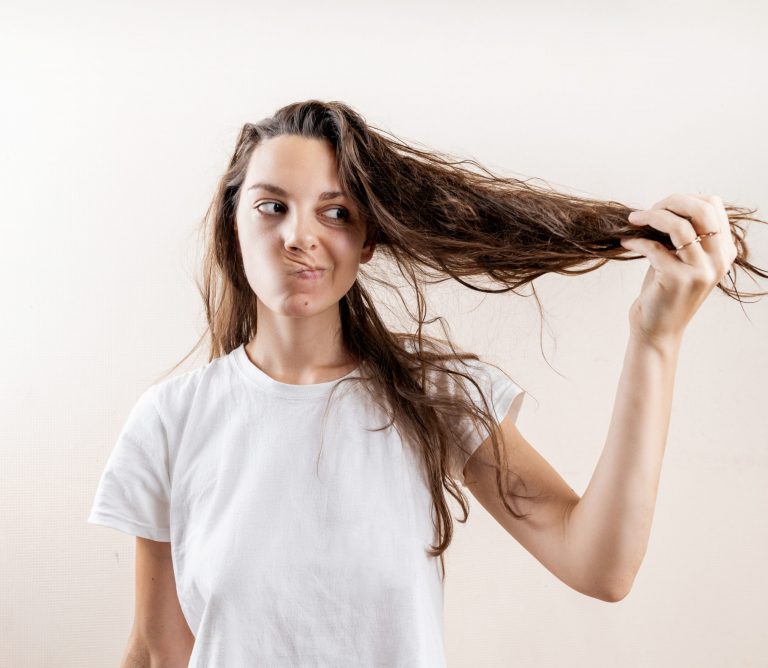 Beautiful caucasian woman girl with wet messy hard after bath. Thin hair problem